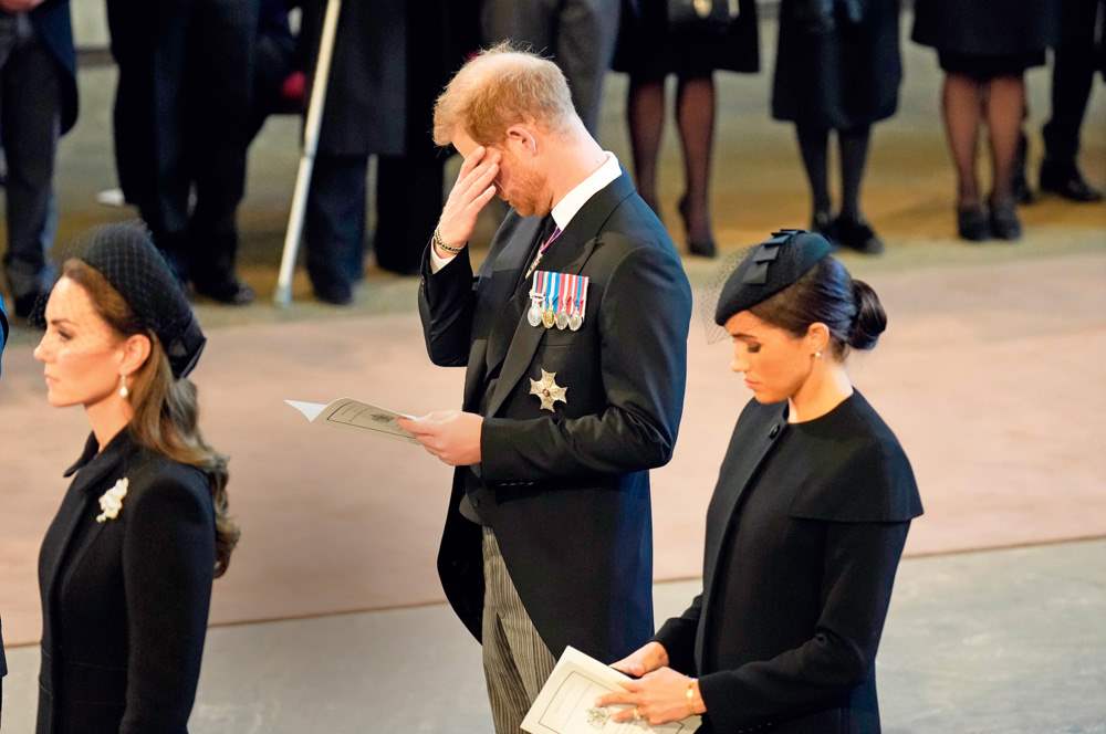 Meghan Markle y Kate Middleton mientras el príncipe Harry llora