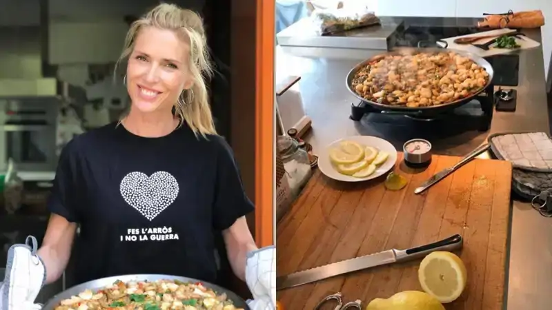 Una cocina con una isla grande y mucho blanco
